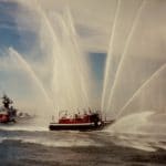 Fireboat "Firefighter" Marine Unit 2, playing out for a US Navy ship entering Boston Harbor, circa 1985.