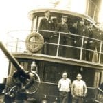 Captain John Williams, top center, aboard Fireboat 'Angus McDonald', Engine 44, circa 1930.