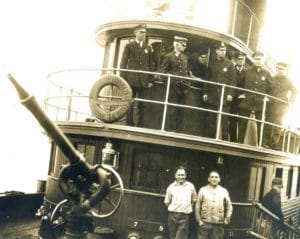 Captain John Williams, top center, aboard Fireboat 'Angus McDonald', Engine 44, circa 1930.