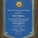 Plaque awarded to David Watkins for Long and Faithful Service by Boston Fire Fighters Local 718, IAFF, June 21, 1994.